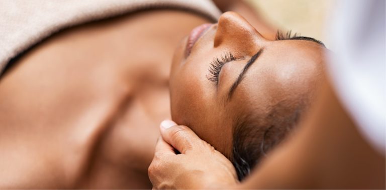 A lady getting a massage on face | Lymphatic Therapy | Avail Aesthetics in Cary, Raleigh & Wake Forest, NC