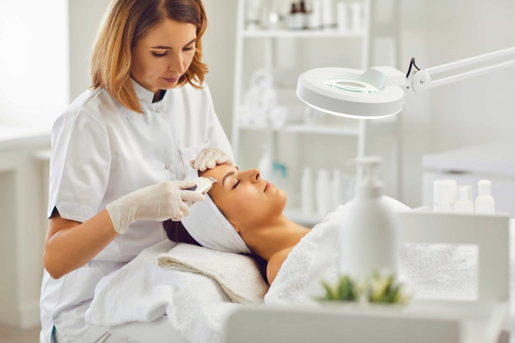 Female cosmetologist treating young women | Avail Aesthetics | Best medspa in Cary, Raleigh & Wake Forest, NC