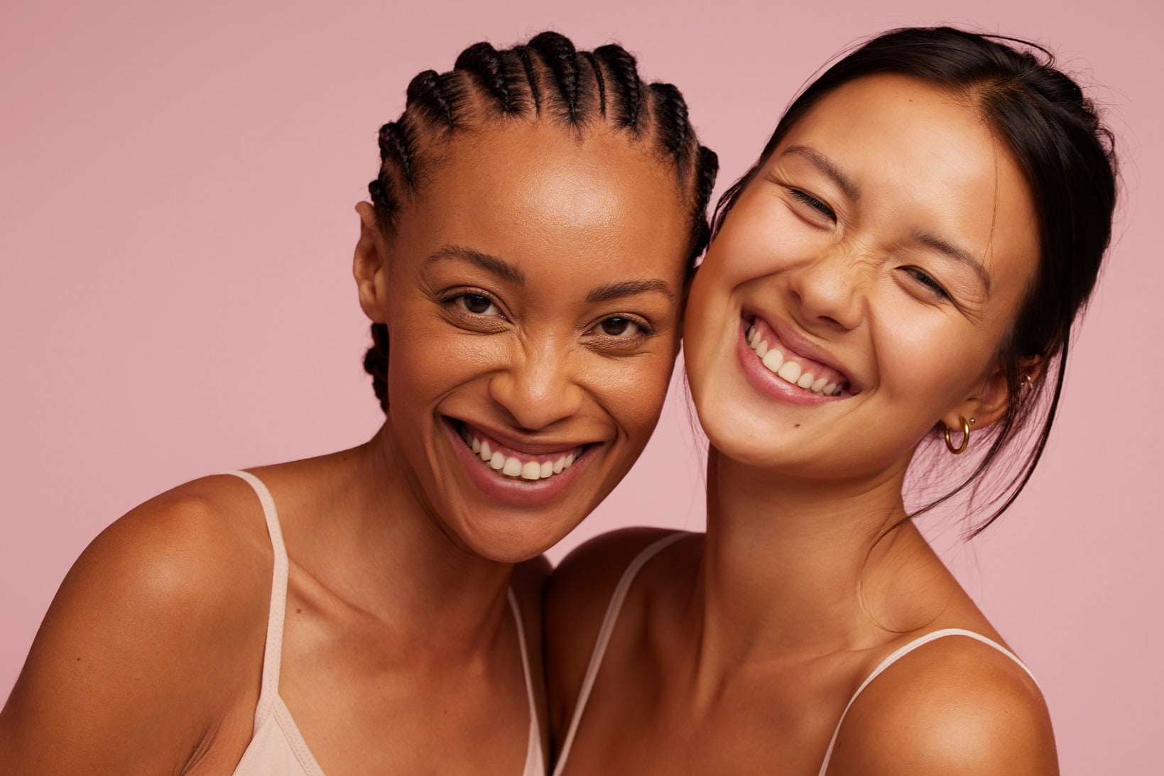 Asian and African Beautiful Smiling Woman | Avail Aesthetics in wake Forest, Raleigh, & Cary, NC