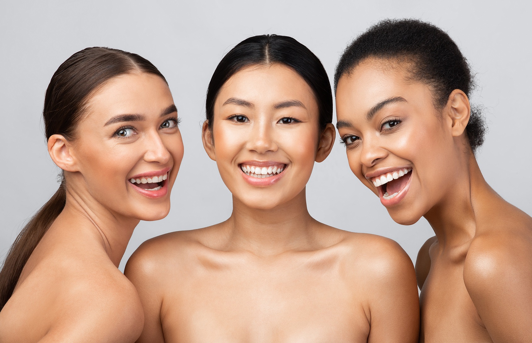 Three Joyful Female Models Posing Smiling To Camera | Avail Aesthetics in Cary, NC
