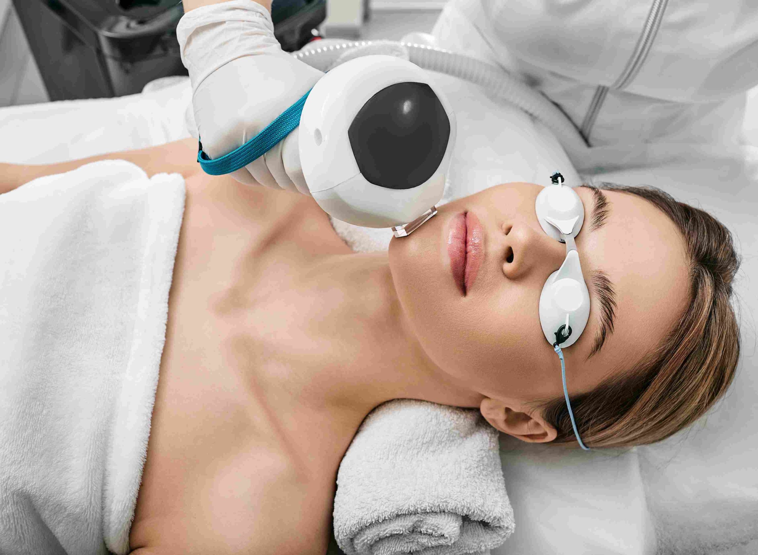 Young Girl Getting ThreeForMe Laser Treatment by Wearing Safety Goggles | Avail Aesthetics in Cary, NC