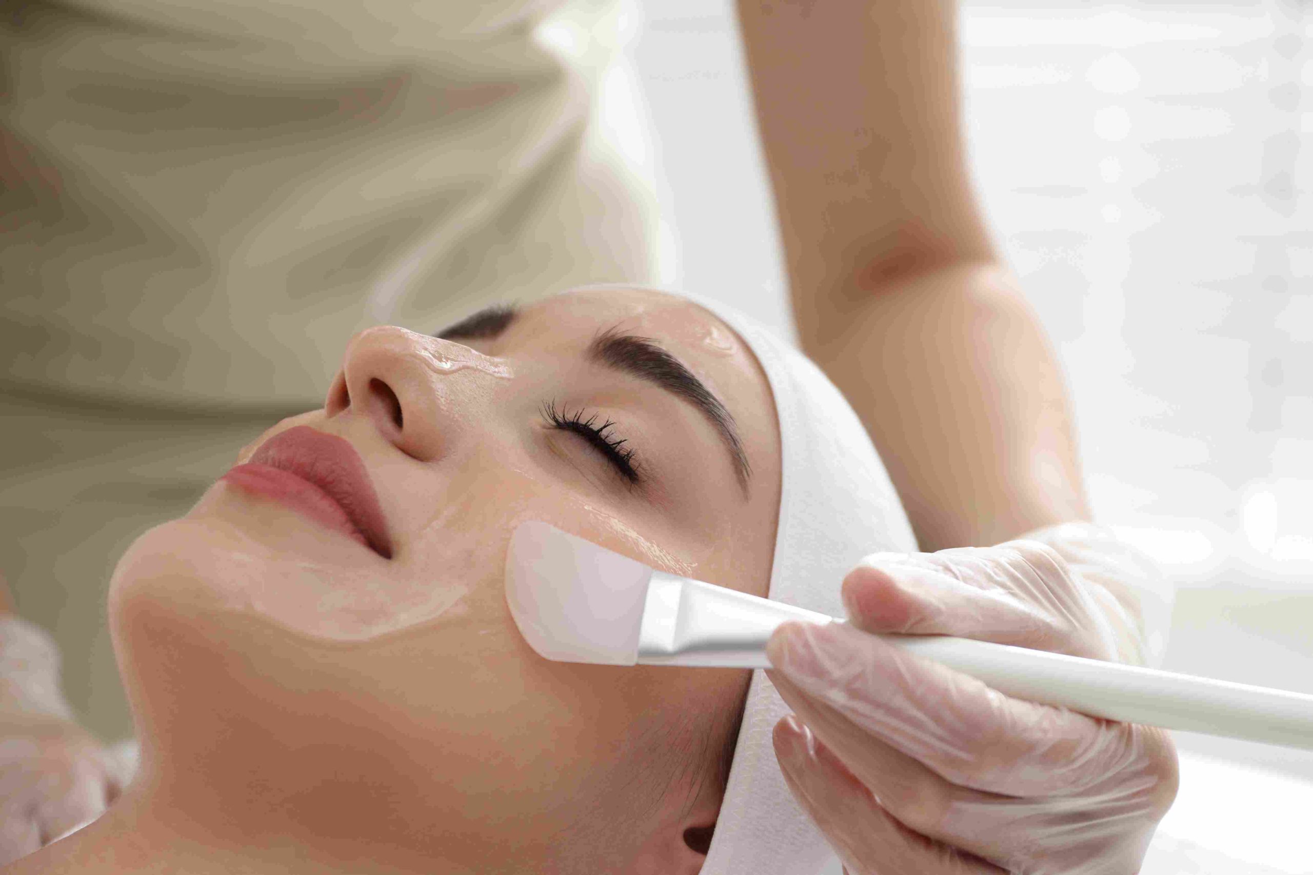 Laying relaxing woman getting chemical-peels mask on spa | Avail Aesthetics in Raleigh, NC