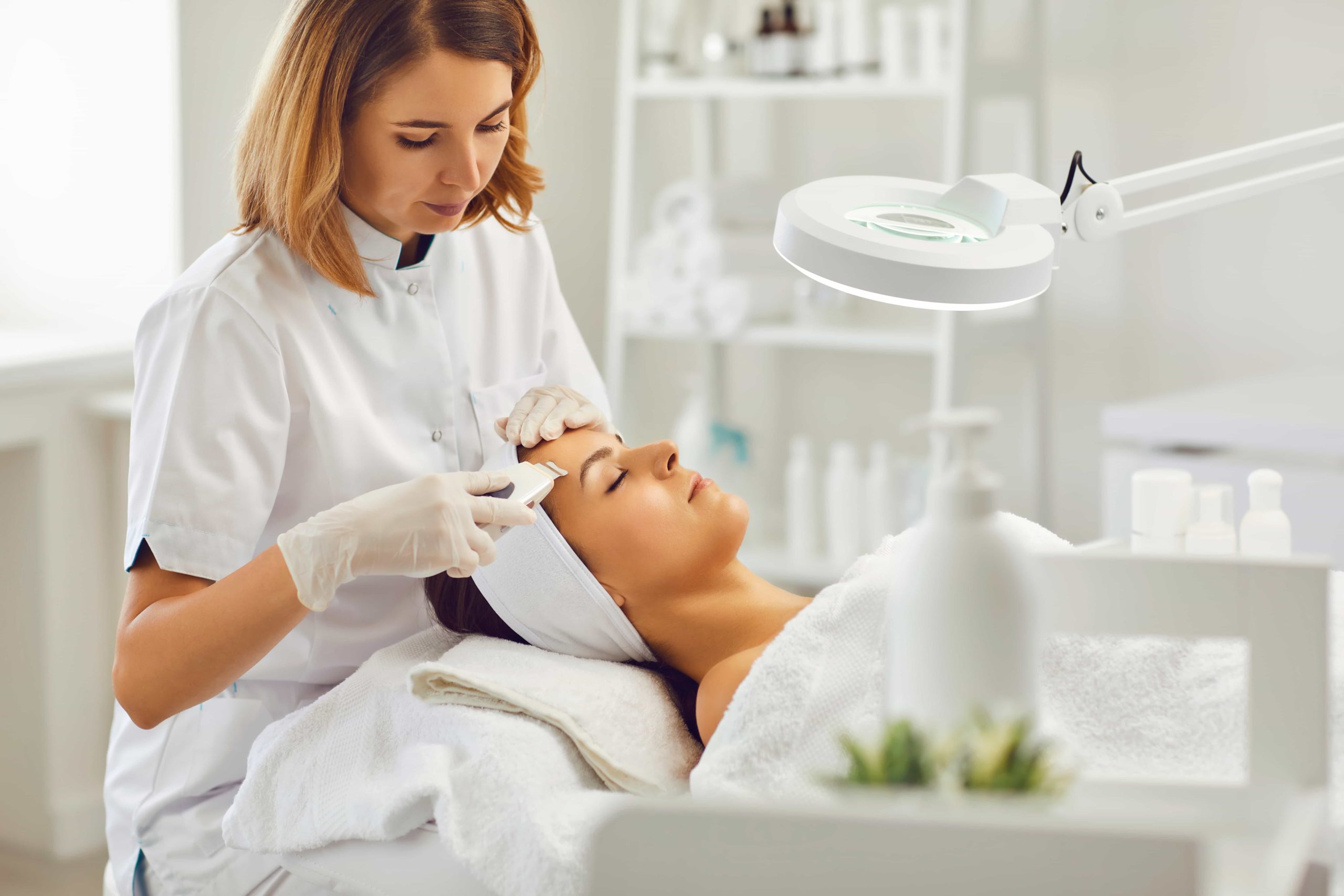 Female cosmetologist treating young women | Avail Aesthetics | Best medspa in Cary, Raleigh & Wake Forest, NC